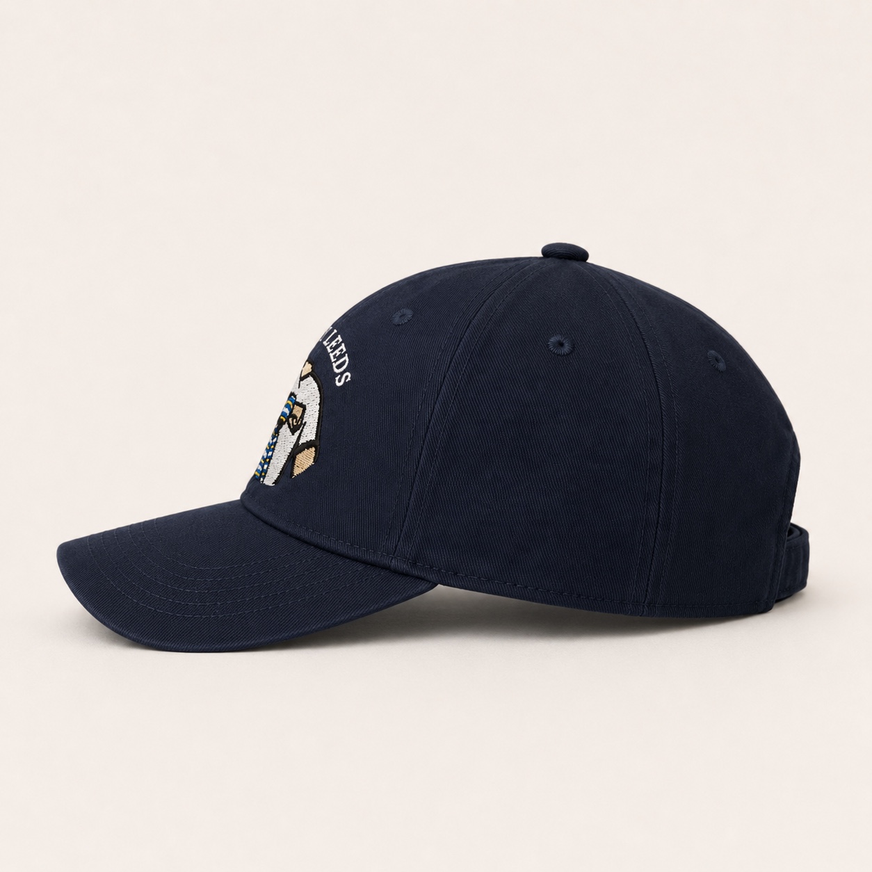 Dirty Leeds® Original Keep Fighting Salute Logo Navy Baseball Cap – side view.