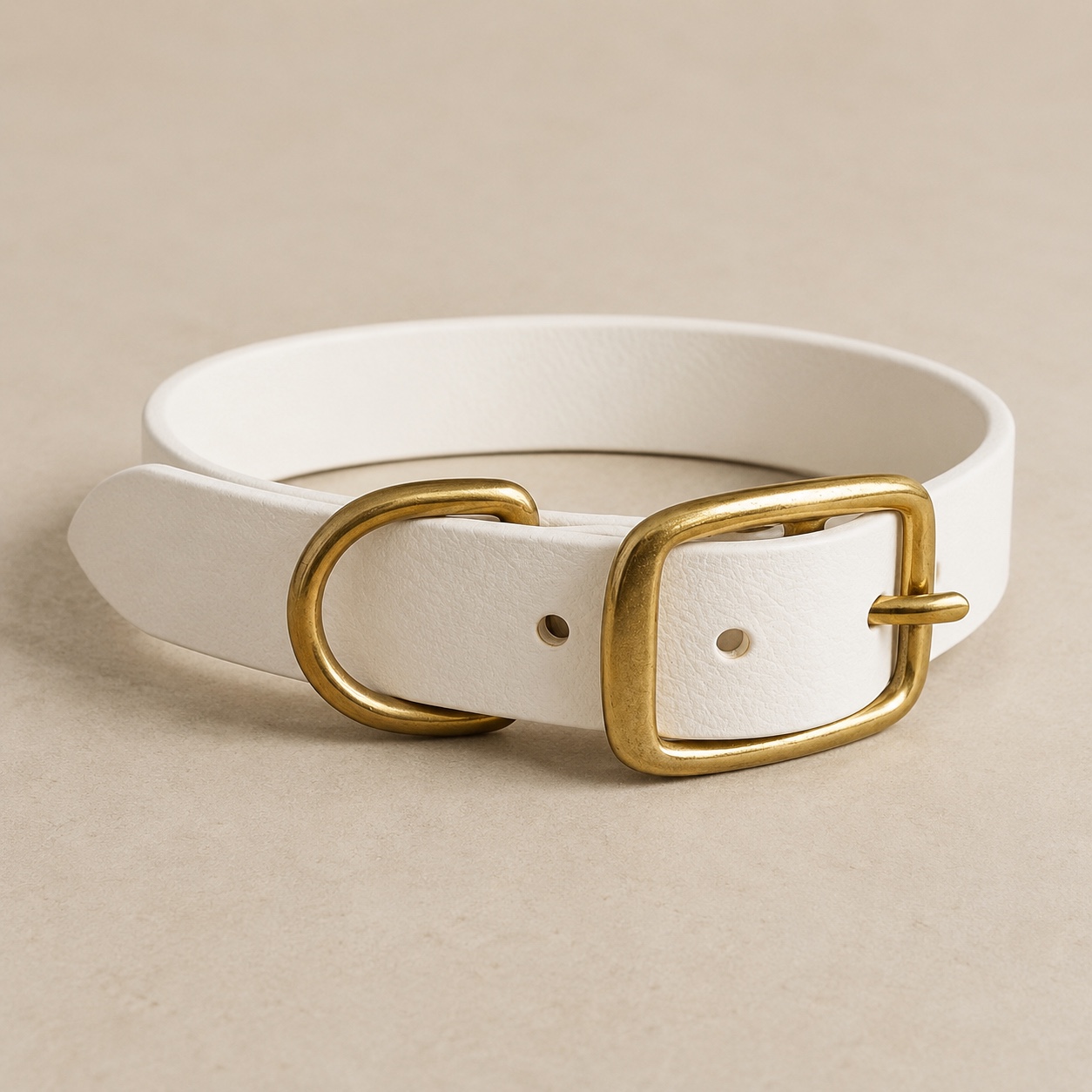 Front view of the Dirty Leeds® white made-to-measure dog collar with solid brass buckle and D-ring.