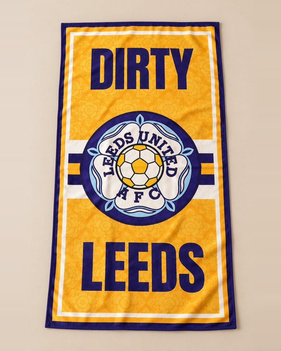 Dirty Leeds® XL Luxury Leeds United beach towel shown flat against a light stone background.