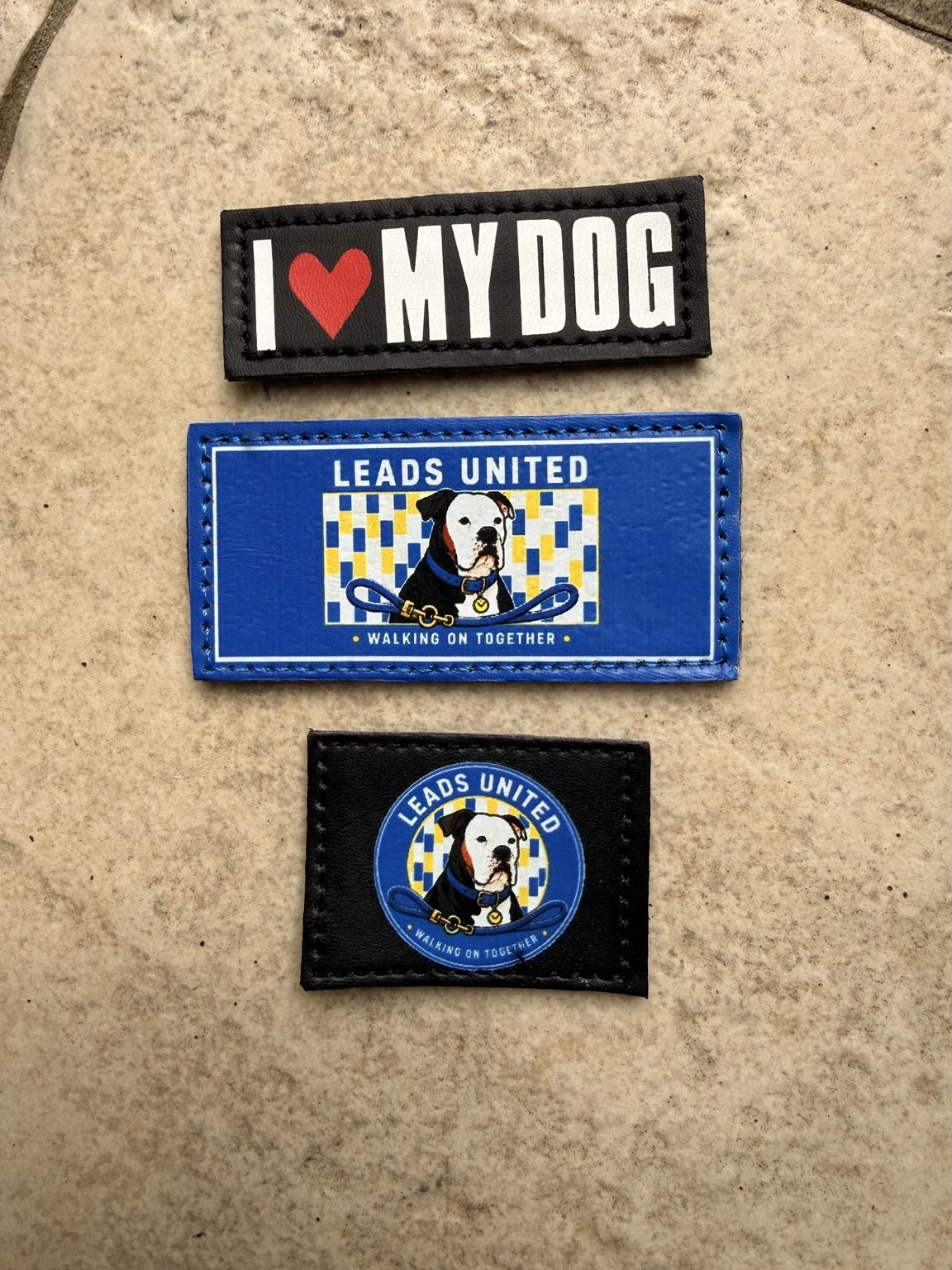 The three removable patches supplied with the Leads United harness set.